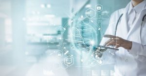 Healthcare professional reviewing projected DNA and medical data from a digital tablet